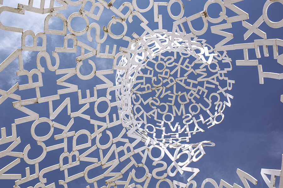 letters on a blue background in a spiral