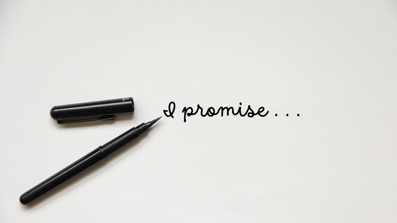 A pen next to cursive words saying I promise...